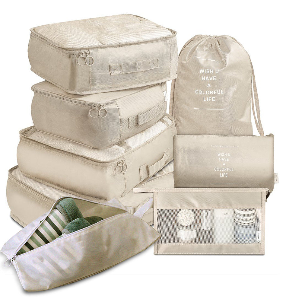 Beige 8 piece packing cube set: 4 zip cubes, drawstring bag, shoe bag, flat pouch and mesh toiletry bag