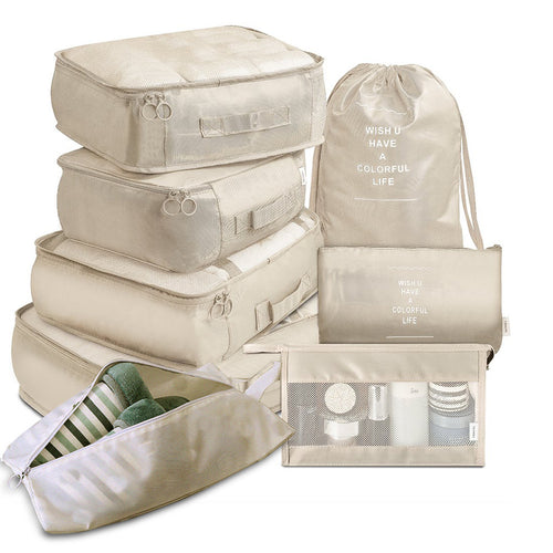 Beige 8 piece packing cube set: 4 zip cubes, drawstring bag, shoe bag, flat pouch and mesh toiletry bag